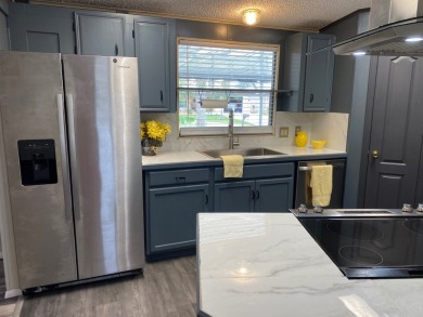 Lovely 2/2 in vibrant 55+ lease hold ($844) community. Wall of on Spanish Lakes Fairways in Florida - for sale on GolfHomes.com, golf home, golf lot