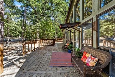 Welcome home to a warm and inviting retreat tucked away among on Holly Lake Ranch Golf Club in Texas - for sale on GolfHomes.com, golf home, golf lot