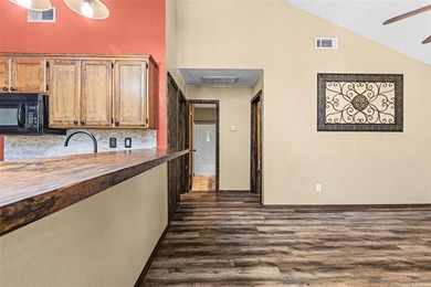 Welcome home to a warm and inviting retreat tucked away among on Holly Lake Ranch Golf Club in Texas - for sale on GolfHomes.com, golf home, golf lot