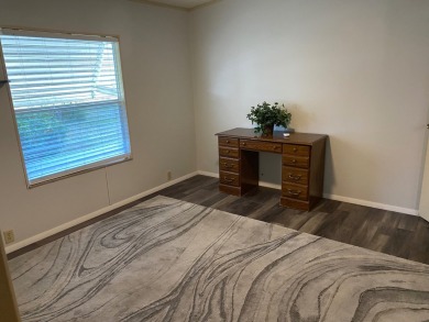 Lovely 2/2 in vibrant 55+ lease hold ($844) community. Wall of on Spanish Lakes Fairways in Florida - for sale on GolfHomes.com, golf home, golf lot