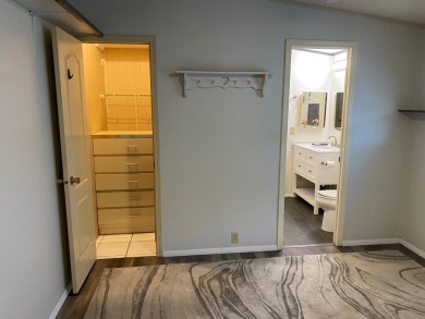 Lovely 2/2 in vibrant 55+ lease hold ($844) community. Wall of on Spanish Lakes Fairways in Florida - for sale on GolfHomes.com, golf home, golf lot