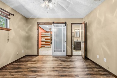 Welcome home to a warm and inviting retreat tucked away among on Holly Lake Ranch Golf Club in Texas - for sale on GolfHomes.com, golf home, golf lot