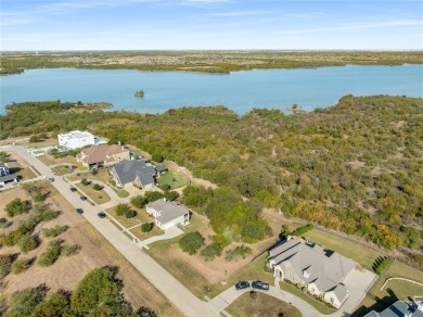 Discover the beauty of Joe Pool Lake with this one-of-a-kind lot on Tangle Ridge Golf Club in Texas - for sale on GolfHomes.com, golf home, golf lot