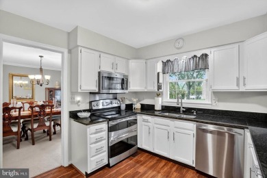 Discover your forever home in Bay Hills! This charming 4-bedroom on Bay Hills Golf Club in Maryland - for sale on GolfHomes.com, golf home, golf lot