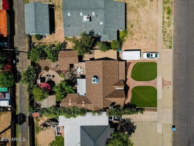 Stunning Tudor Revival home offering a perfect blend of classic on Encanto 18 Golf Course in Arizona - for sale on GolfHomes.com, golf home, golf lot