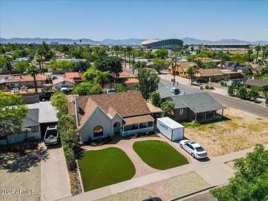 Stunning Tudor Revival home offering a perfect blend of classic on Encanto 18 Golf Course in Arizona - for sale on GolfHomes.com, golf home, golf lot