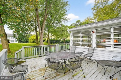 Discover your forever home in Bay Hills! This charming 4-bedroom on Bay Hills Golf Club in Maryland - for sale on GolfHomes.com, golf home, golf lot