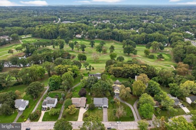 Discover your forever home in Bay Hills! This charming 4-bedroom on Bay Hills Golf Club in Maryland - for sale on GolfHomes.com, golf home, golf lot