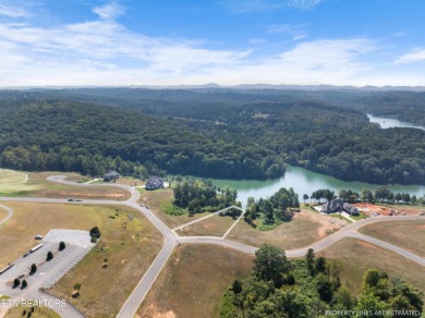 This exquisite 0.51 acre waterfront lot on Tellico Lake offers a on Wind River Golf Course in Tennessee - for sale on GolfHomes.com, golf home, golf lot