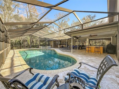 Welcome to 50 Willowood Ln -- a private luxury estate in Oldsmar on East Lake Woodlands Country Club in Florida - for sale on GolfHomes.com, golf home, golf lot