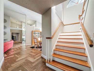 Welcome to 50 Willowood Ln -- a private luxury estate in Oldsmar on East Lake Woodlands Country Club in Florida - for sale on GolfHomes.com, golf home, golf lot