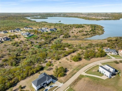 Discover the beauty of Joe Pool Lake and the Prestigious Gated on Tangle Ridge Golf Club in Texas - for sale on GolfHomes.com, golf home, golf lot