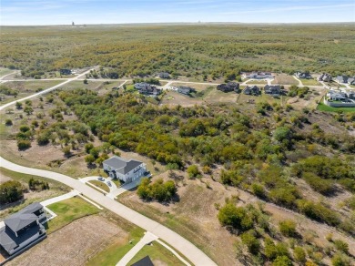 Discover the beauty of Joe Pool Lake and the Prestigious Gated on Tangle Ridge Golf Club in Texas - for sale on GolfHomes.com, golf home, golf lot