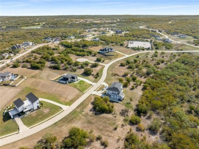 Discover the beauty of Joe Pool Lake and the Prestigious Gated on Tangle Ridge Golf Club in Texas - for sale on GolfHomes.com, golf home, golf lot