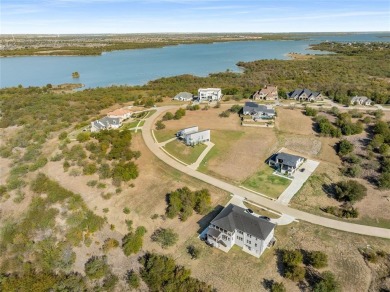 Discover the beauty of Joe Pool Lake and the Prestigious Gated on Tangle Ridge Golf Club in Texas - for sale on GolfHomes.com, golf home, golf lot