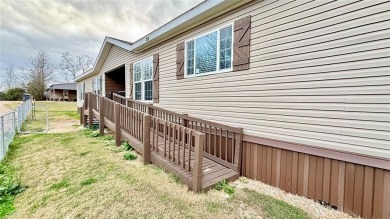 Embrace the charm of lakeside living with this impressive on Links At Lands End in Texas - for sale on GolfHomes.com, golf home, golf lot