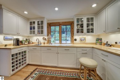 Nestled on an incredibly rare, private 2.47 wooded acres in on Leland Country Club in Michigan - for sale on GolfHomes.com, golf home, golf lot