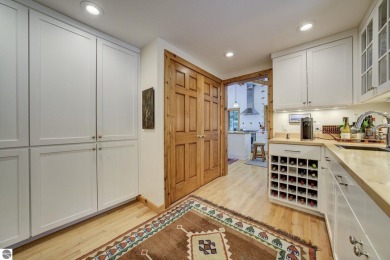 Nestled on an incredibly rare, private 2.47 wooded acres in on Leland Country Club in Michigan - for sale on GolfHomes.com, golf home, golf lot