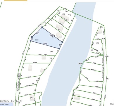 Just under an acre of waterfront property in the Sunset Lakes on Oyster Bay Golf Links in North Carolina - for sale on GolfHomes.com, golf home, golf lot