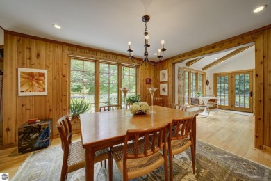 Nestled on an incredibly rare, private 2.47 wooded acres in on Leland Country Club in Michigan - for sale on GolfHomes.com, golf home, golf lot