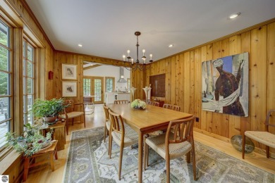 Nestled on an incredibly rare, private 2.47 wooded acres in on Leland Country Club in Michigan - for sale on GolfHomes.com, golf home, golf lot