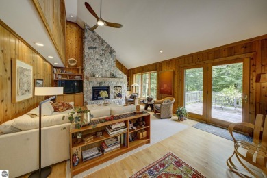 Nestled on an incredibly rare, private 2.47 wooded acres in on Leland Country Club in Michigan - for sale on GolfHomes.com, golf home, golf lot