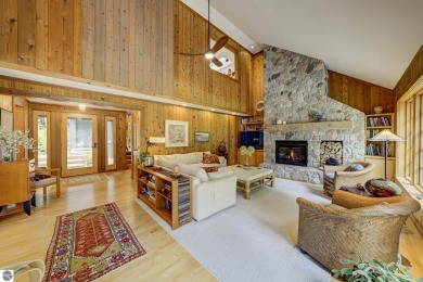 Nestled on an incredibly rare, private 2.47 wooded acres in on Leland Country Club in Michigan - for sale on GolfHomes.com, golf home, golf lot