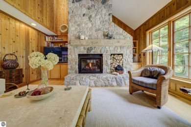 Nestled on an incredibly rare, private 2.47 wooded acres in on Leland Country Club in Michigan - for sale on GolfHomes.com, golf home, golf lot