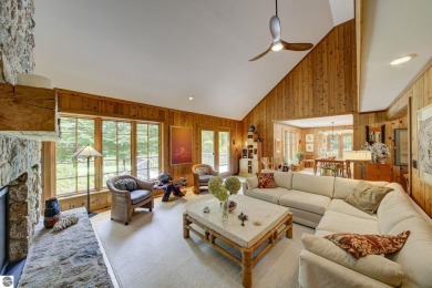 Nestled on an incredibly rare, private 2.47 wooded acres in on Leland Country Club in Michigan - for sale on GolfHomes.com, golf home, golf lot