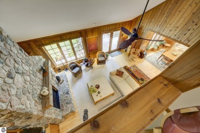 Nestled on an incredibly rare, private 2.47 wooded acres in on Leland Country Club in Michigan - for sale on GolfHomes.com, golf home, golf lot