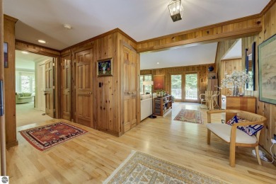 Nestled on an incredibly rare, private 2.47 wooded acres in on Leland Country Club in Michigan - for sale on GolfHomes.com, golf home, golf lot