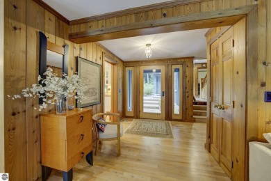 Nestled on an incredibly rare, private 2.47 wooded acres in on Leland Country Club in Michigan - for sale on GolfHomes.com, golf home, golf lot
