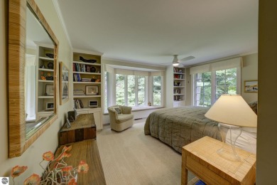 Nestled on an incredibly rare, private 2.47 wooded acres in on Leland Country Club in Michigan - for sale on GolfHomes.com, golf home, golf lot