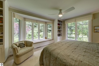Nestled on an incredibly rare, private 2.47 wooded acres in on Leland Country Club in Michigan - for sale on GolfHomes.com, golf home, golf lot
