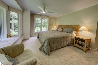 Nestled on an incredibly rare, private 2.47 wooded acres in on Leland Country Club in Michigan - for sale on GolfHomes.com, golf home, golf lot