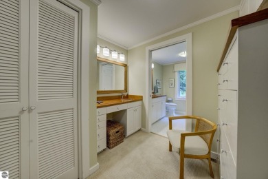 Nestled on an incredibly rare, private 2.47 wooded acres in on Leland Country Club in Michigan - for sale on GolfHomes.com, golf home, golf lot
