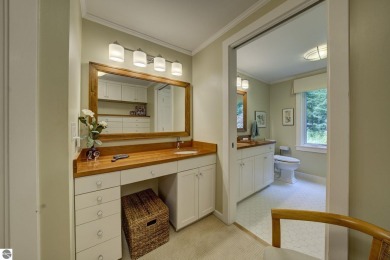 Nestled on an incredibly rare, private 2.47 wooded acres in on Leland Country Club in Michigan - for sale on GolfHomes.com, golf home, golf lot