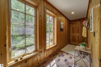 Nestled on an incredibly rare, private 2.47 wooded acres in on Leland Country Club in Michigan - for sale on GolfHomes.com, golf home, golf lot