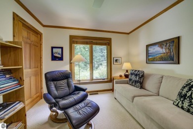 Nestled on an incredibly rare, private 2.47 wooded acres in on Leland Country Club in Michigan - for sale on GolfHomes.com, golf home, golf lot