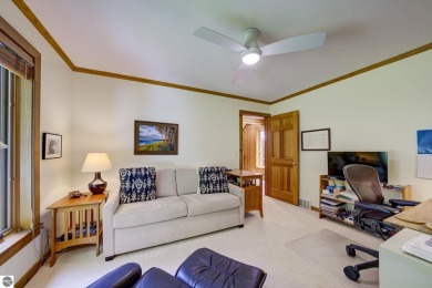 Nestled on an incredibly rare, private 2.47 wooded acres in on Leland Country Club in Michigan - for sale on GolfHomes.com, golf home, golf lot