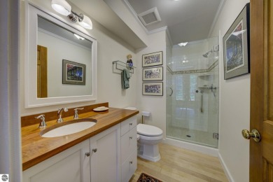 Nestled on an incredibly rare, private 2.47 wooded acres in on Leland Country Club in Michigan - for sale on GolfHomes.com, golf home, golf lot
