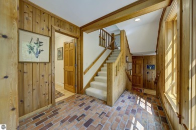 Nestled on an incredibly rare, private 2.47 wooded acres in on Leland Country Club in Michigan - for sale on GolfHomes.com, golf home, golf lot