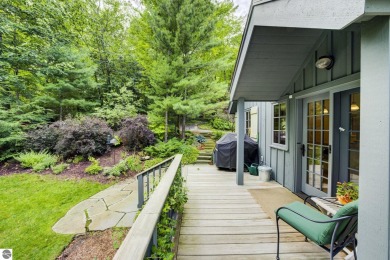 Nestled on an incredibly rare, private 2.47 wooded acres in on Leland Country Club in Michigan - for sale on GolfHomes.com, golf home, golf lot