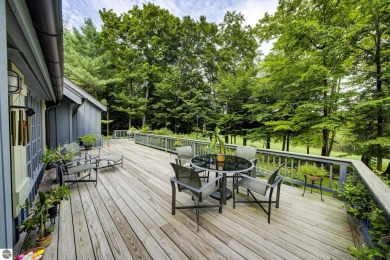 Nestled on an incredibly rare, private 2.47 wooded acres in on Leland Country Club in Michigan - for sale on GolfHomes.com, golf home, golf lot