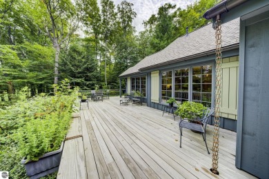 Nestled on an incredibly rare, private 2.47 wooded acres in on Leland Country Club in Michigan - for sale on GolfHomes.com, golf home, golf lot