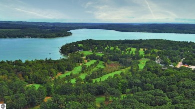 Nestled on an incredibly rare, private 2.47 wooded acres in on Leland Country Club in Michigan - for sale on GolfHomes.com, golf home, golf lot