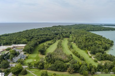 Nestled on an incredibly rare, private 2.47 wooded acres in on Leland Country Club in Michigan - for sale on GolfHomes.com, golf home, golf lot