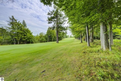 Nestled on an incredibly rare, private 2.47 wooded acres in on Leland Country Club in Michigan - for sale on GolfHomes.com, golf home, golf lot