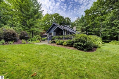 Nestled on an incredibly rare, private 2.47 wooded acres in on Leland Country Club in Michigan - for sale on GolfHomes.com, golf home, golf lot