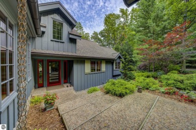 Nestled on an incredibly rare, private 2.47 wooded acres in on Leland Country Club in Michigan - for sale on GolfHomes.com, golf home, golf lot